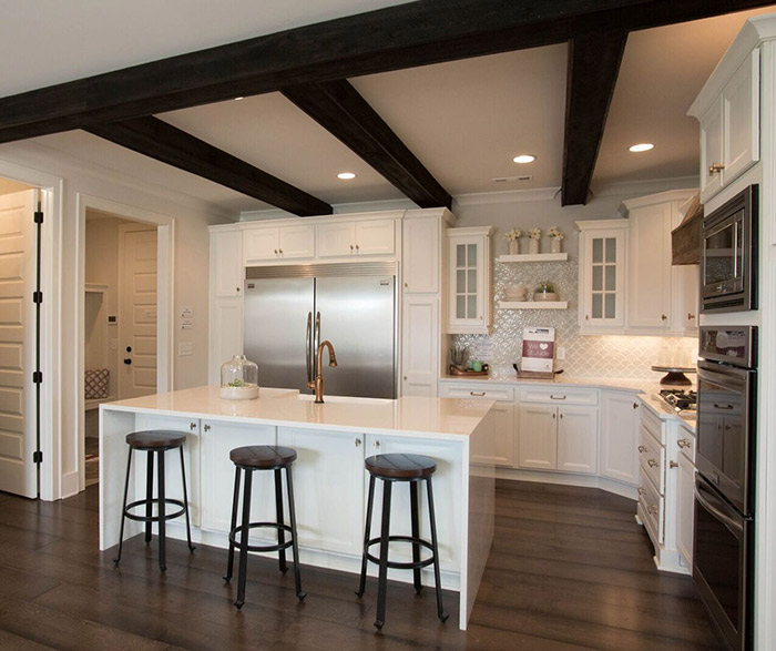 White kitchen cabinets in the Lautner door style